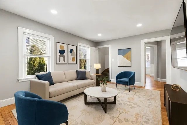 a living room with furniture and a large window
