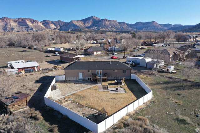 2095 West 4100 North Spring Glen, UT 84526 - Photo 32 of 35 Aerial perspective of suburban area featuring a mountainous background