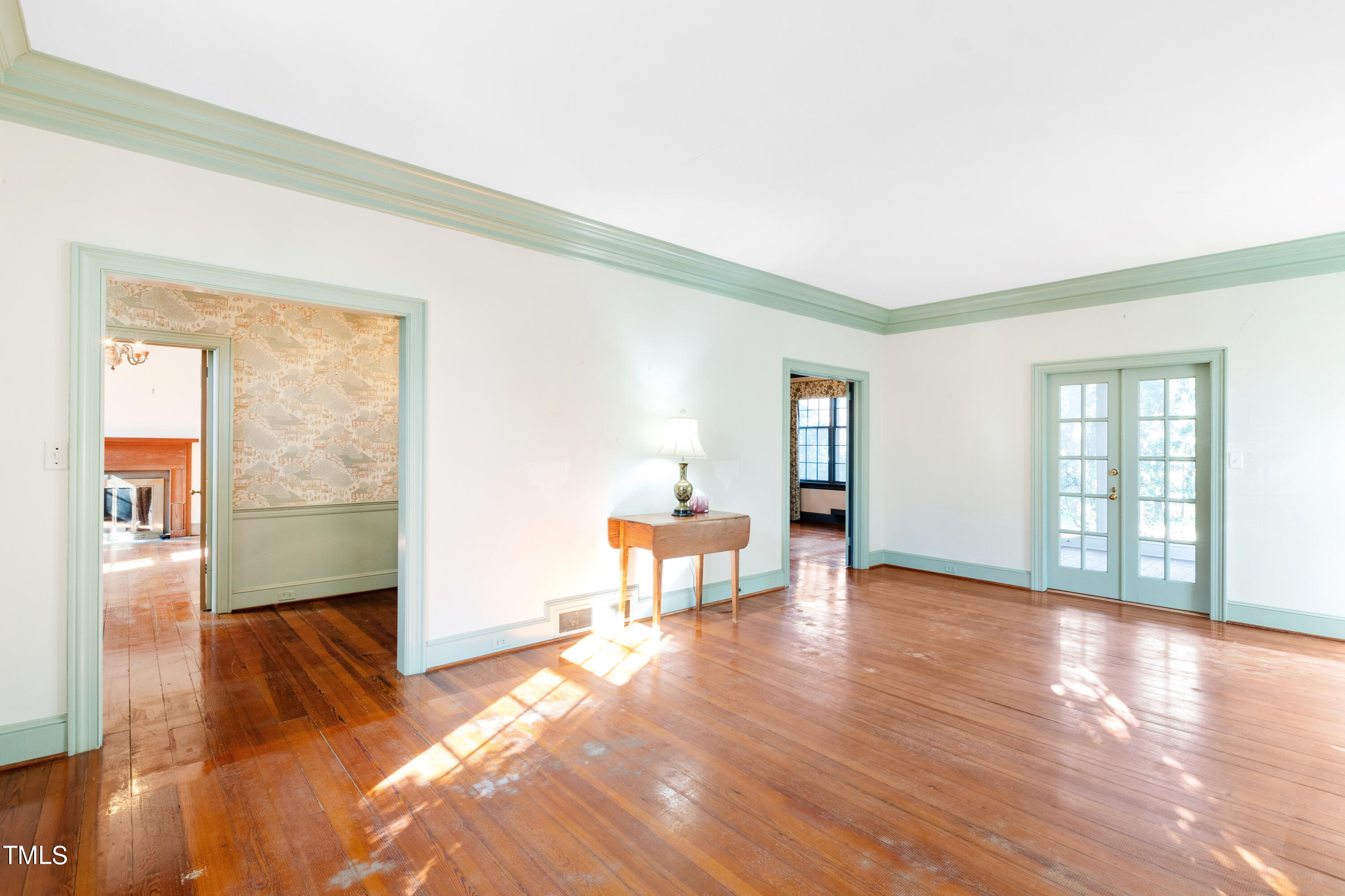 2522 Wake Drive Raleigh, NC 27608 - Photo 11 of 49 a view of empty room with wooden floor and fan
