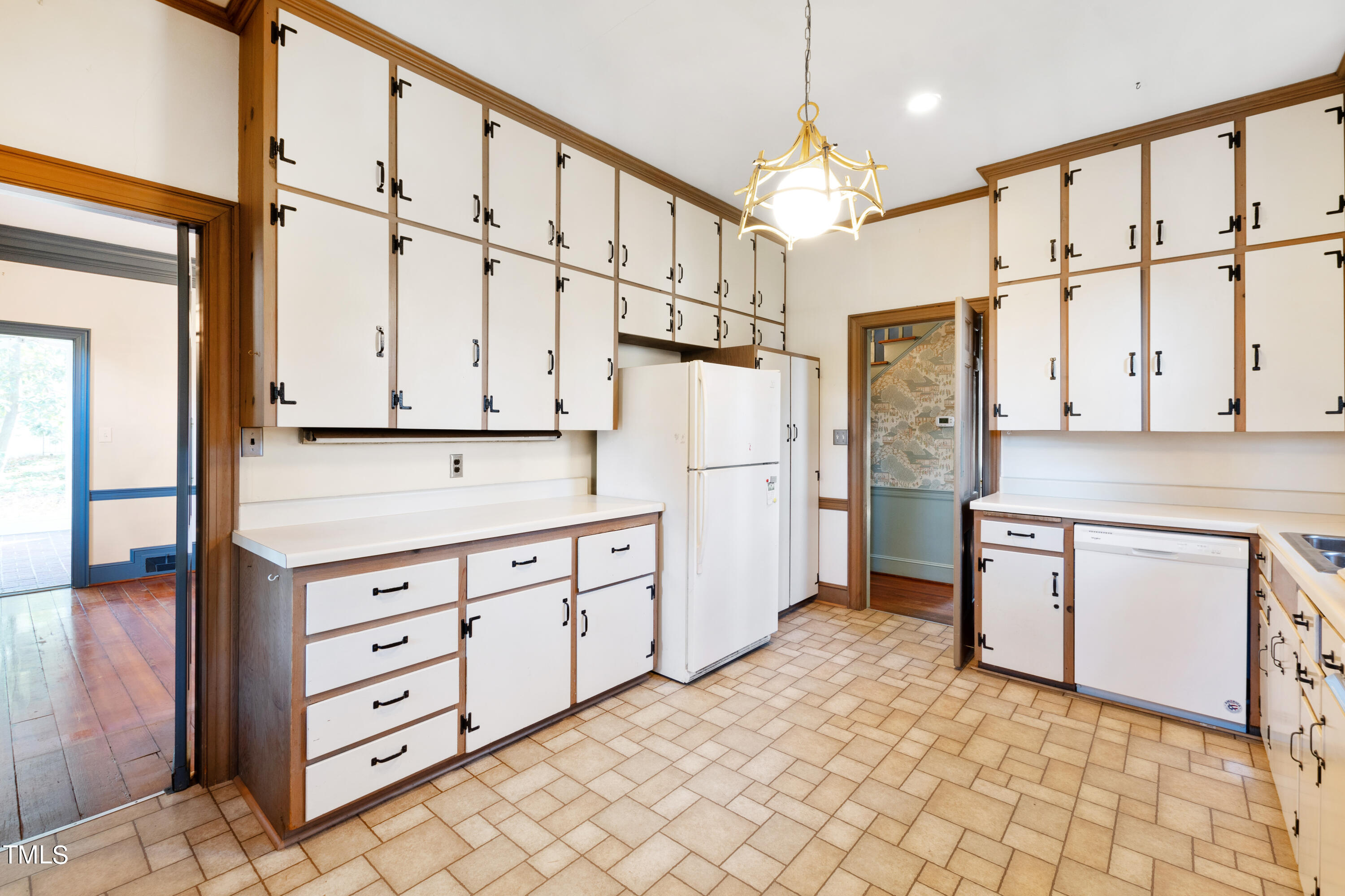2522 Wake Drive Raleigh, NC 27608 - Photo 17 of 49 a kitchen with stainless steel appliances a refrigerator sink and cabinets
