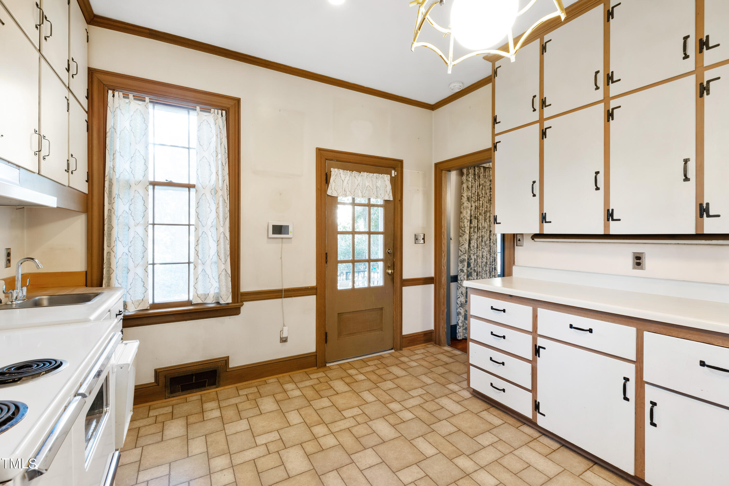 2522 Wake Drive Raleigh, NC 27608 - Photo 18 of 49 a kitchen with granite countertop a sink and a stove