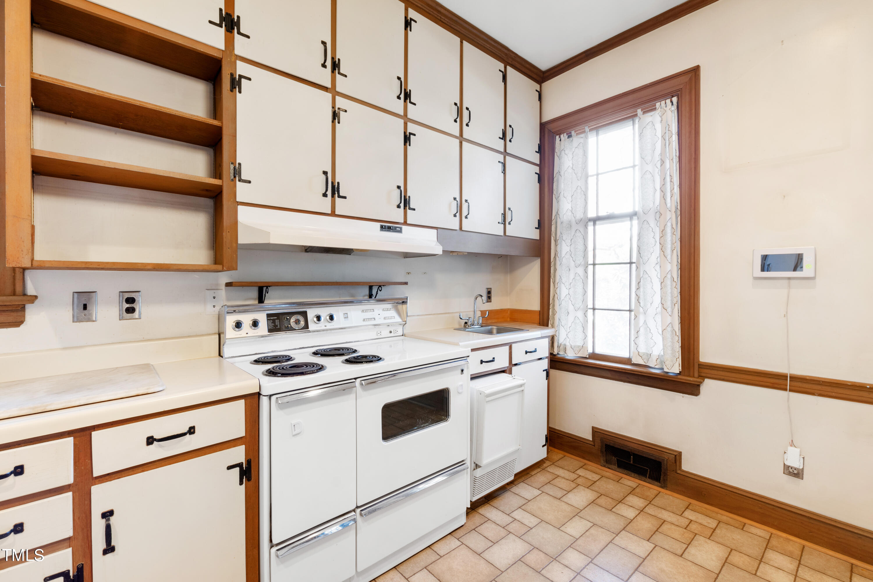 2522 Wake Drive Raleigh, NC 27608 - Photo 20 of 49 a kitchen with stainless steel appliances granite countertop a sink a stove and a window