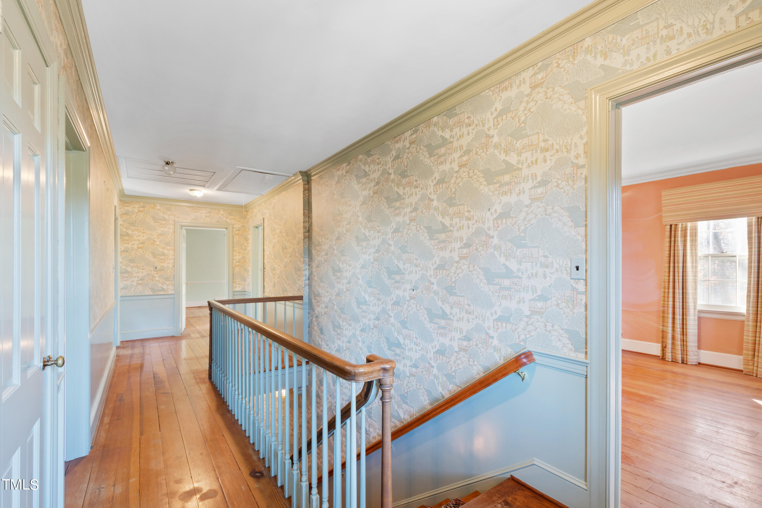 2522 Wake Drive Raleigh, NC 27608 - Photo 25 of 49 a view of a hallway with wooden floor and staircase