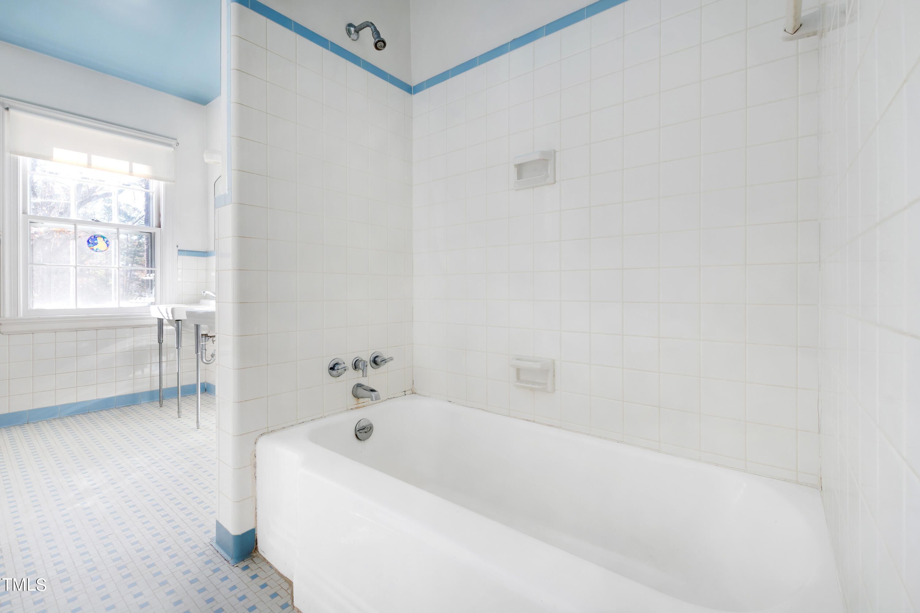 2522 Wake Drive Raleigh, NC 27608 - Photo 32 of 49 a white bath tub sitting next to a window