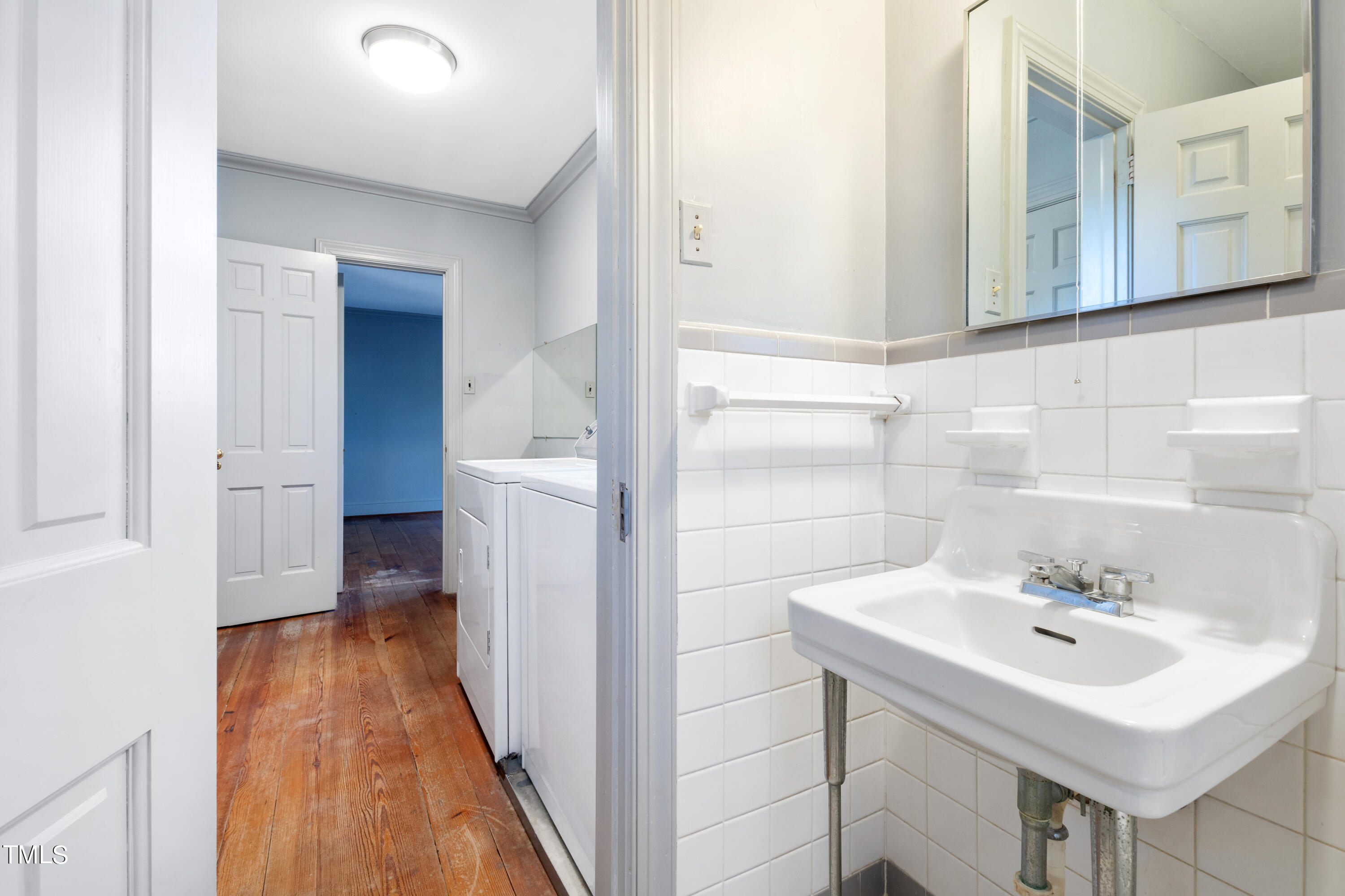 2522 Wake Drive Raleigh, NC 27608 - Photo 33 of 49 a bathroom with a sink a mirror and a toilet