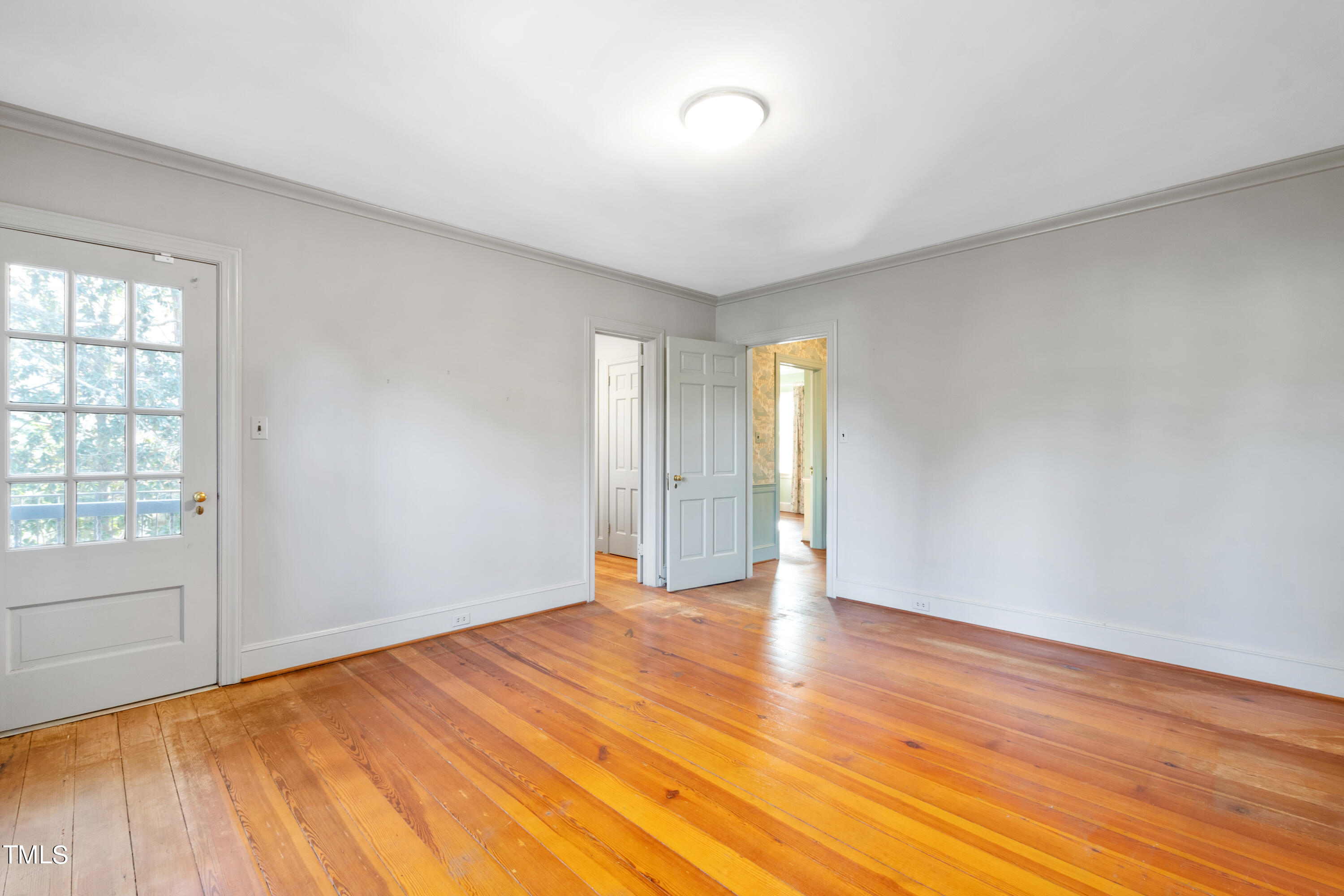 2522 Wake Drive Raleigh, NC 27608 - Photo 38 of 49 wooden floor in an empty room with a window