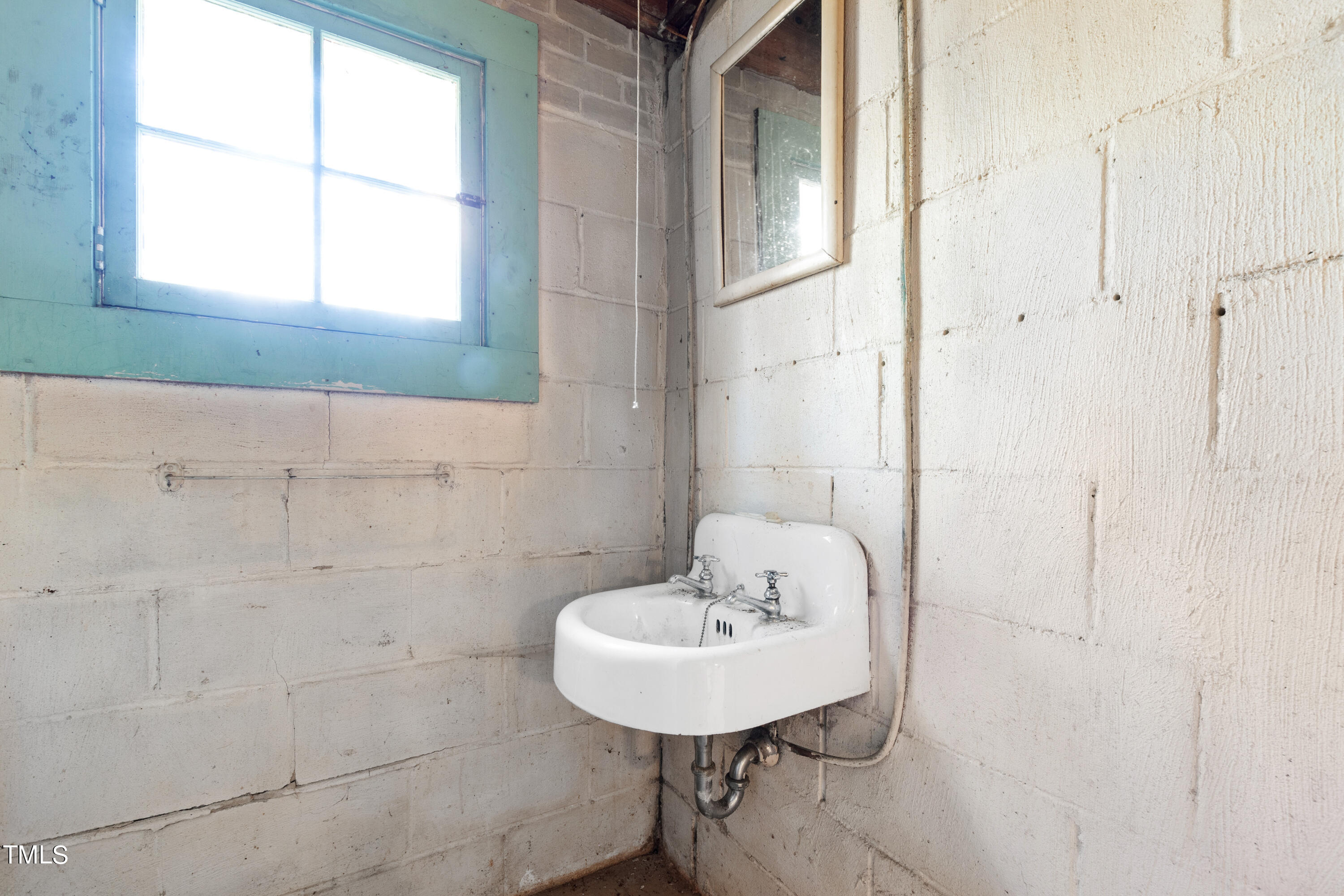 2522 Wake Drive Raleigh, NC 27608 - Photo 45 of 49 a bathroom with a sink and a mirror