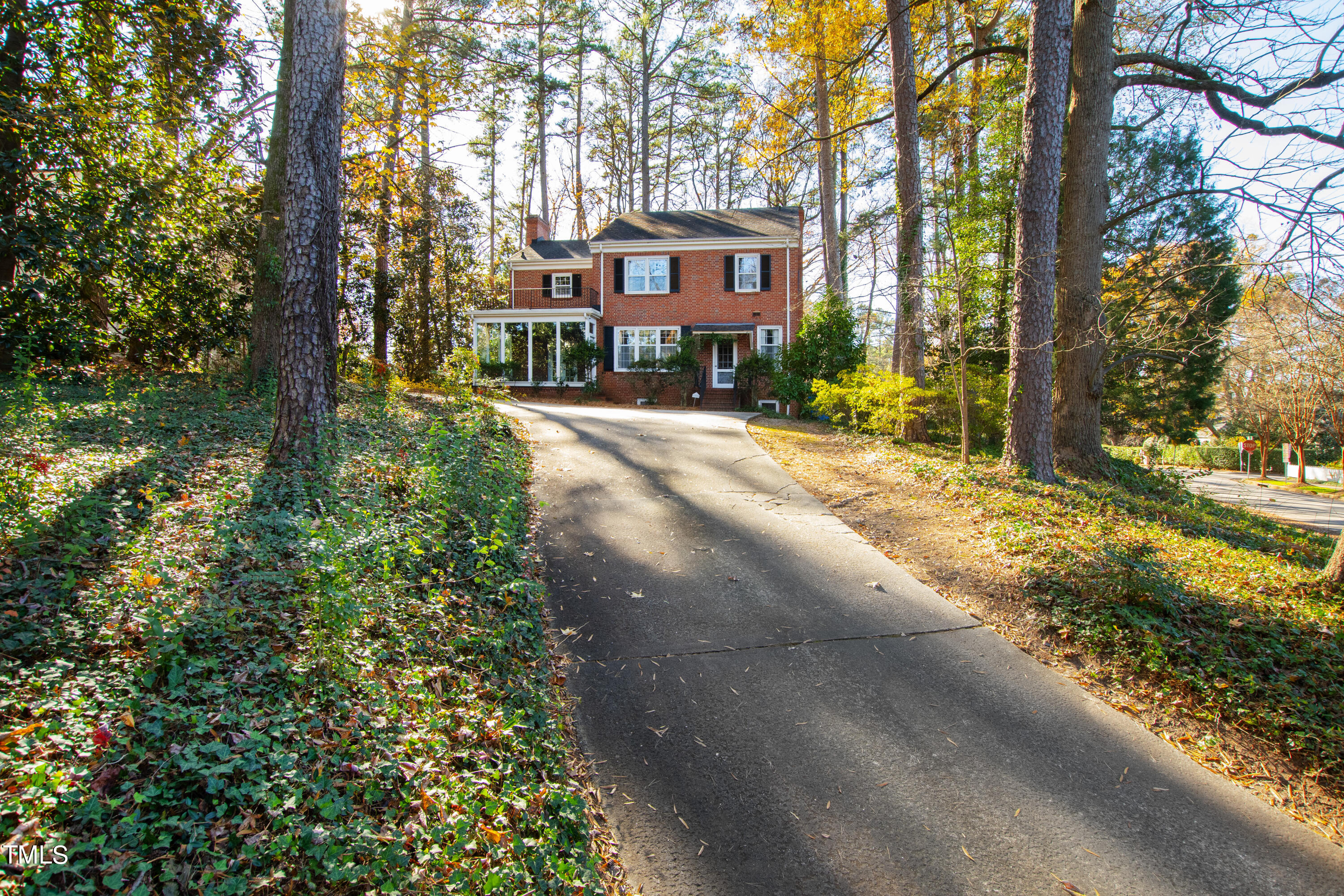 2522 Wake Drive Raleigh, NC 27608 - Photo 47 of 49 a front view of a house with a yard and fountain in middle