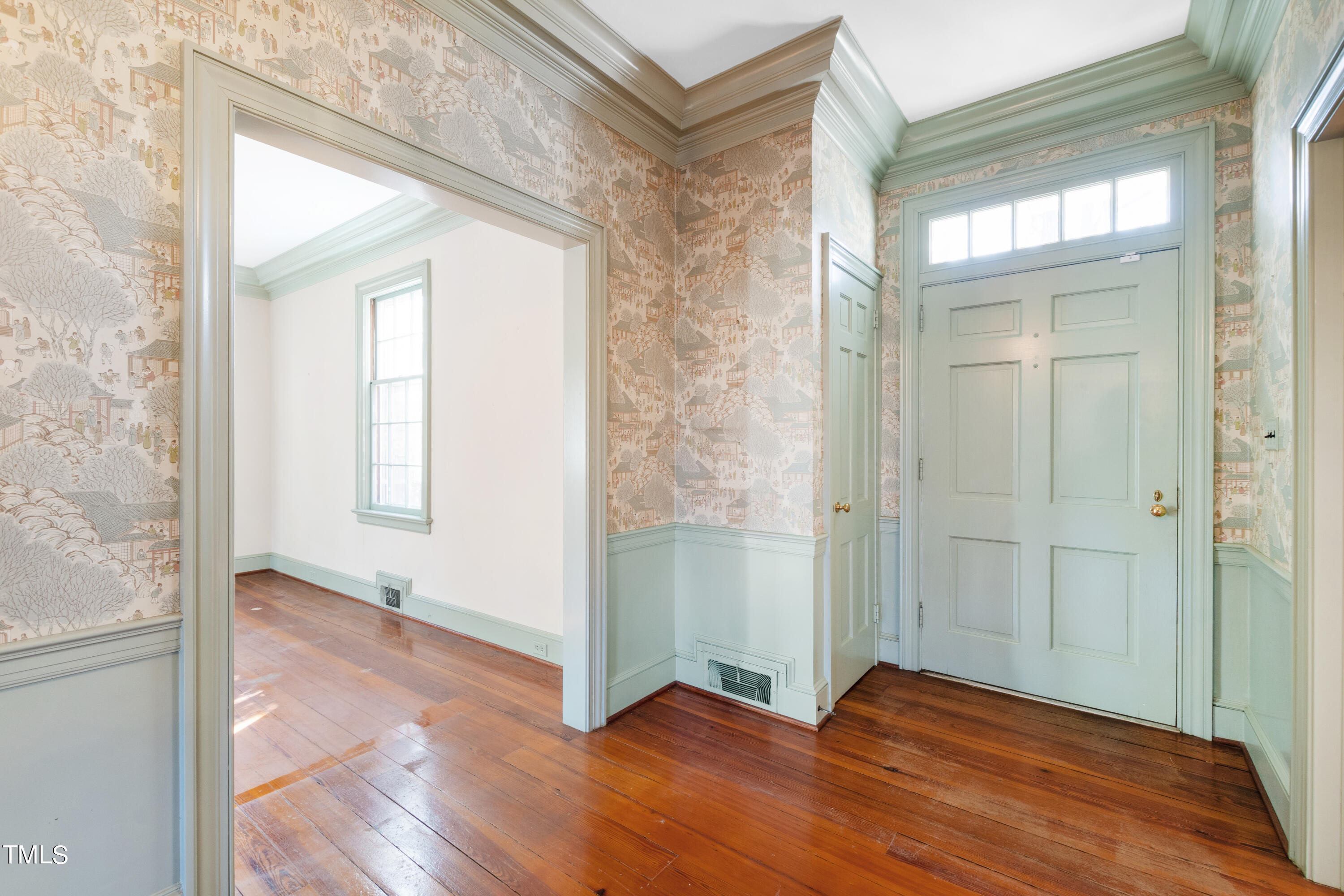 2522 Wake Drive Raleigh, NC 27608 - Photo 5 of 49 a view of an empty room with wooden floor and a window