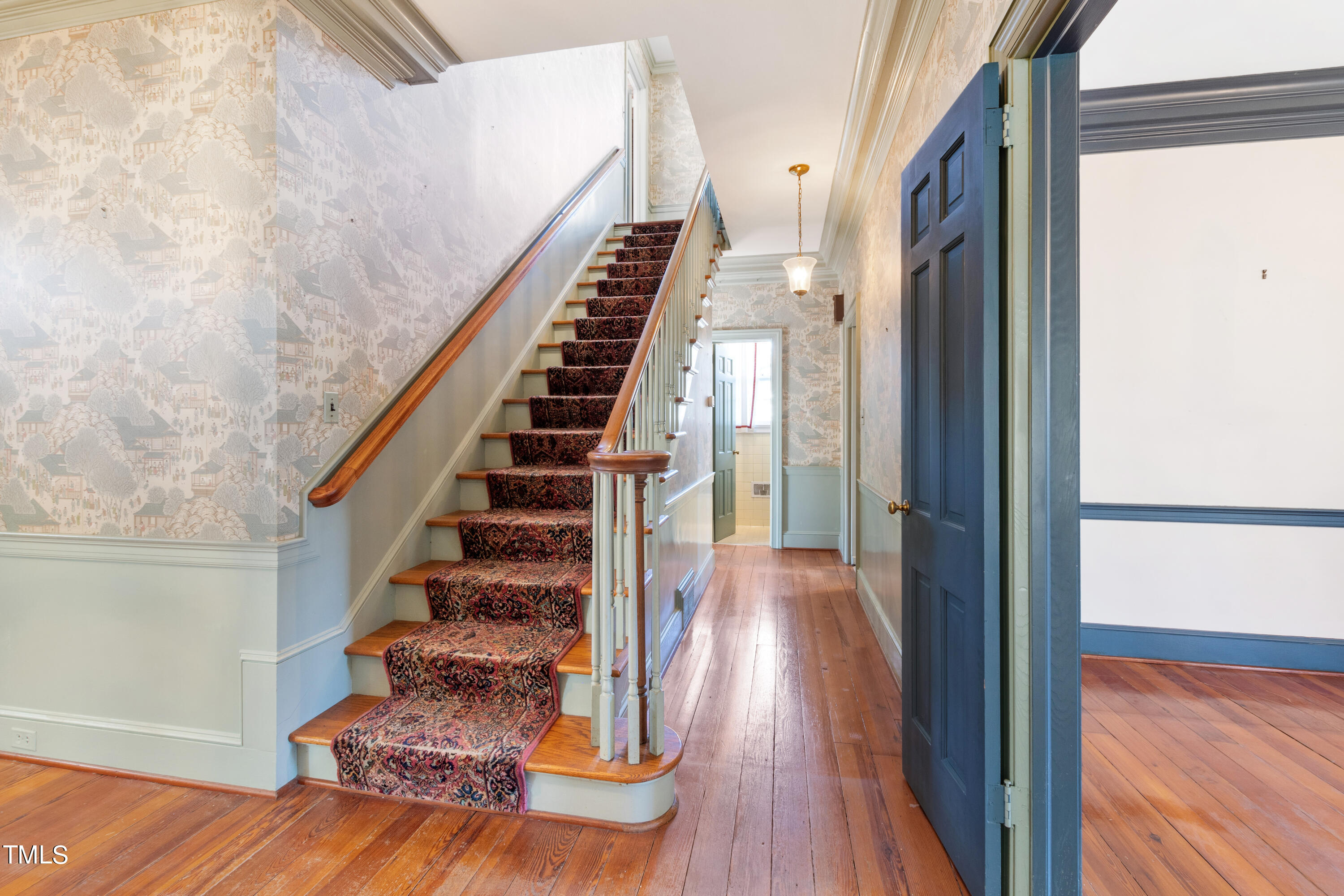 2522 Wake Drive Raleigh, NC 27608 - Photo 7 of 49 a view of entryway and hall with wooden floor