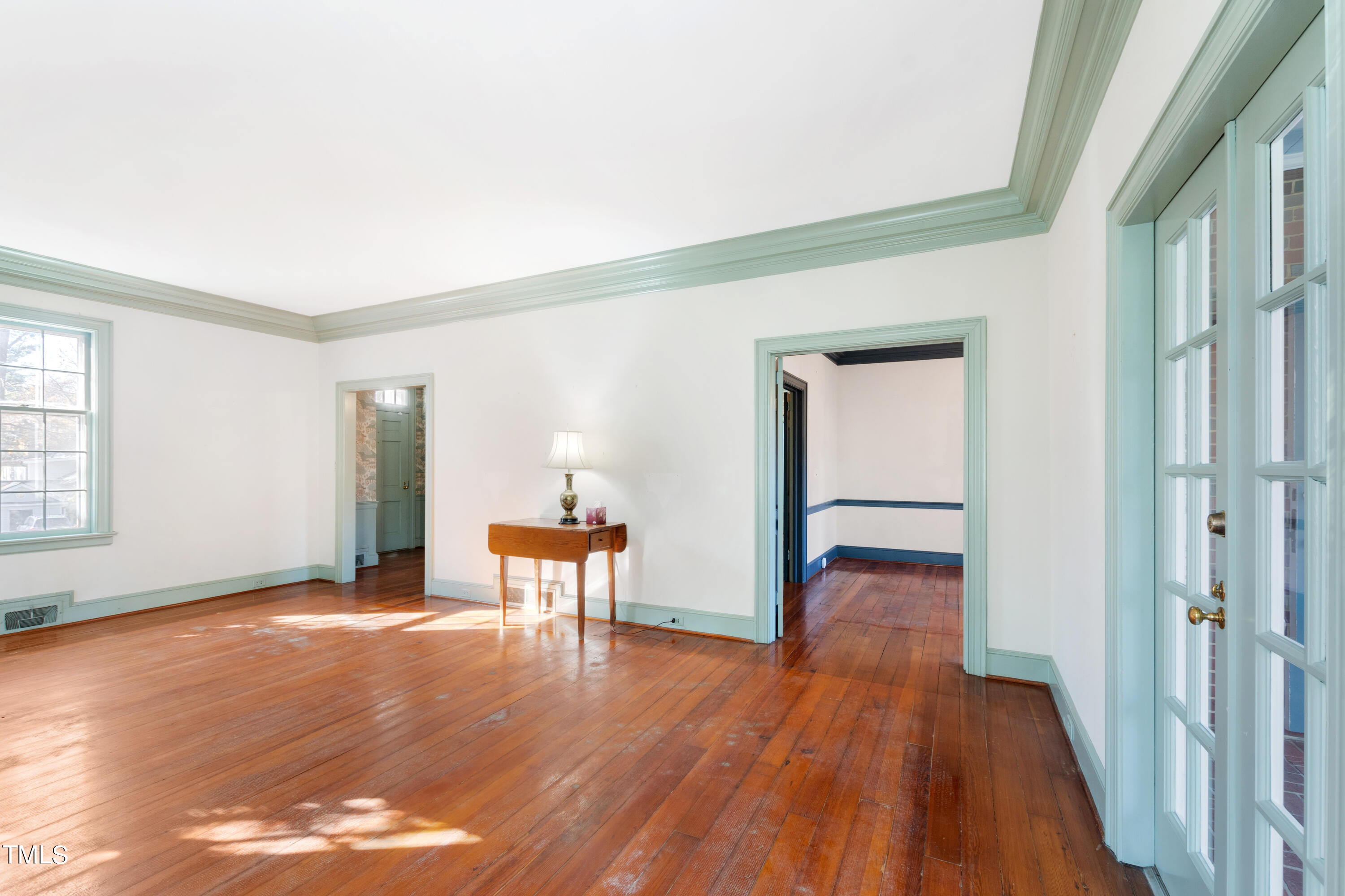 2522 Wake Drive Raleigh, NC 27608 - Photo 10 of 49 a view of a livingroom with wooden floor and furniture