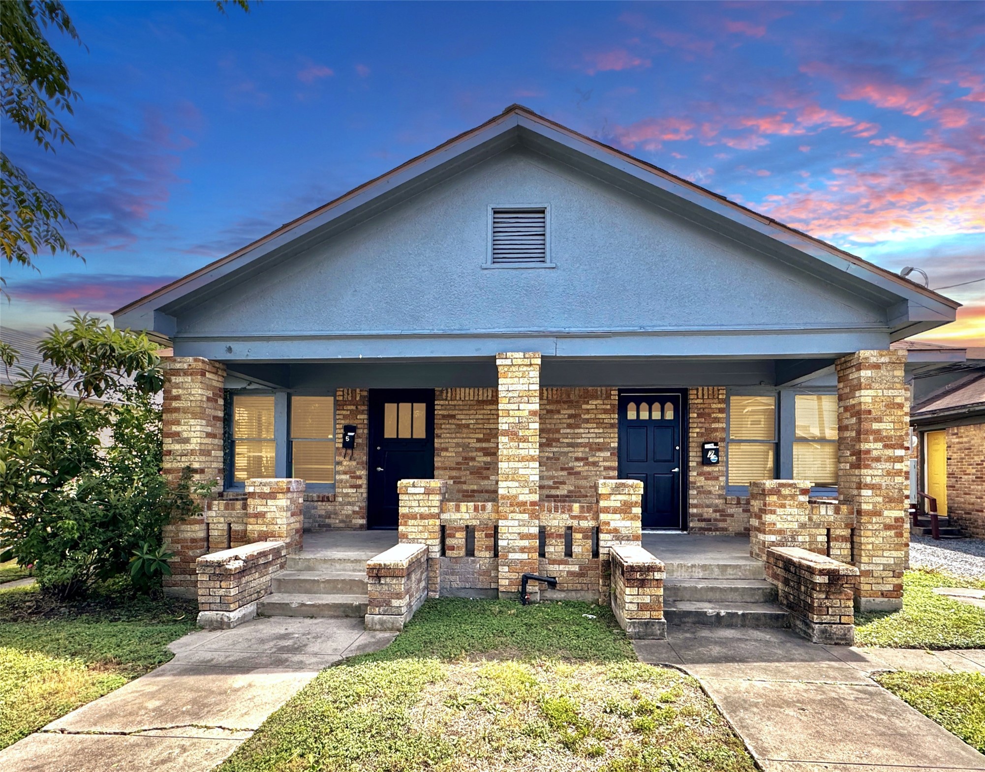 7 Hunt Street Houston, TX 77003 - Photo 1 of 22 a front view of a house with a yard