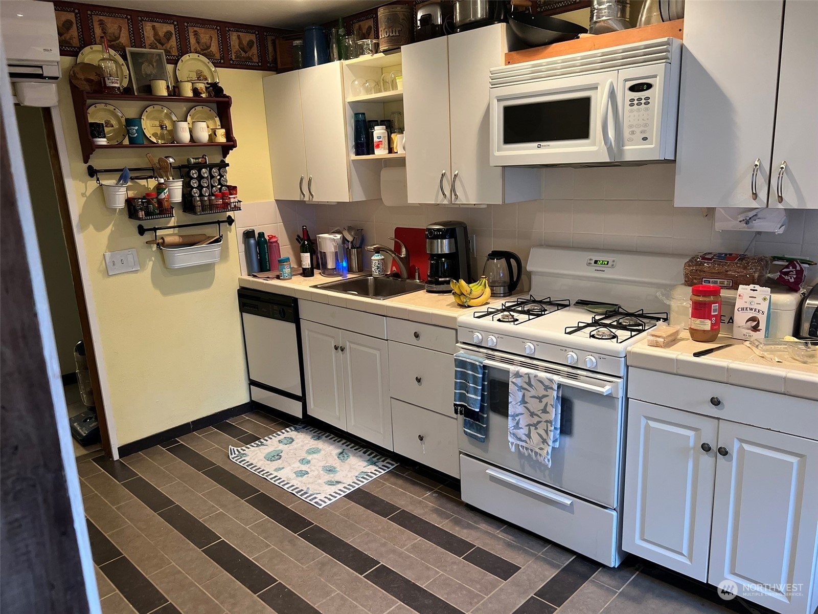 41 4th Street Pacific Beach, WA 98571 - Photo 12 of 23 a kitchen with stainless steel appliances a sink and a stove