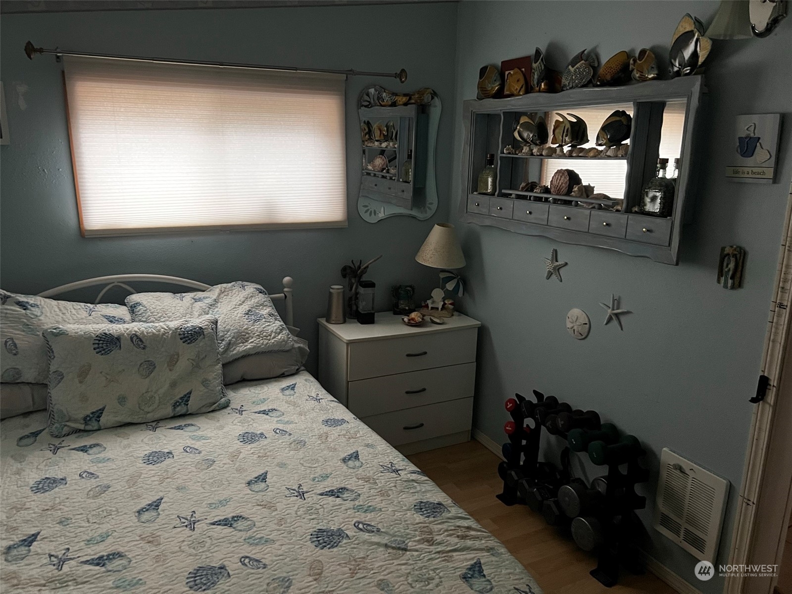 41 4th Street Pacific Beach, WA 98571 - Photo 19 of 23 a bedroom with a bed and cabinets