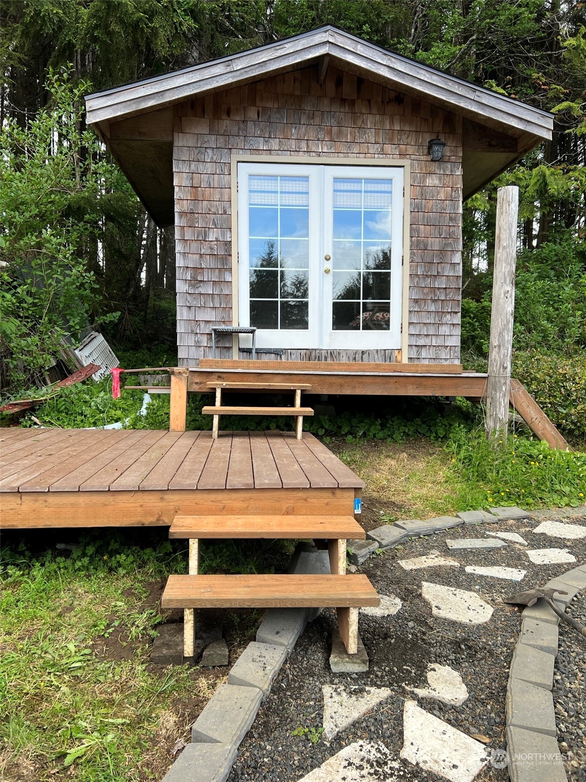 41 4th Street Pacific Beach, WA 98571 - Photo 3 of 23 a backyard of a house with outdoor seating