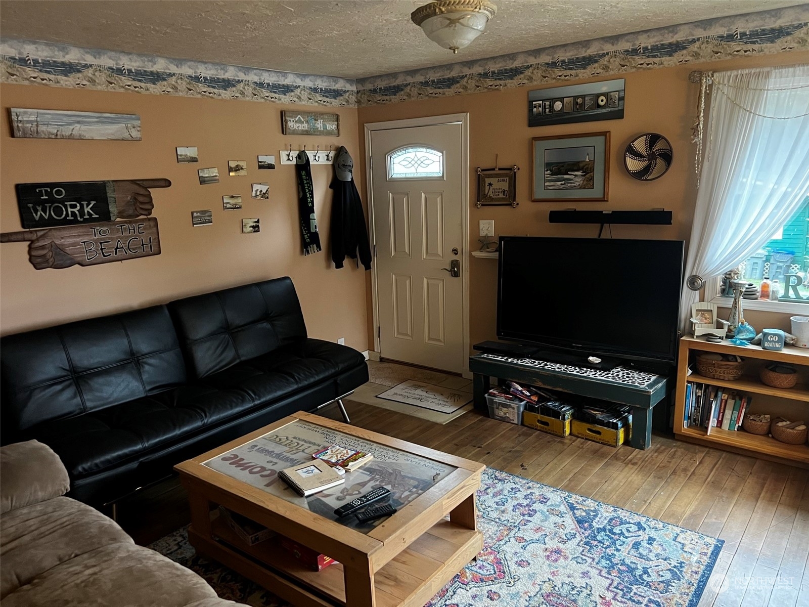 41 4th Street Pacific Beach, WA 98571 - Photo 8 of 23 a living room with furniture and a flat screen tv