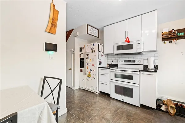 a kitchen with stainless steel appliances a stove and a refrigerator