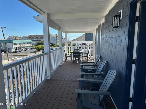 a view of a balcony with chairs