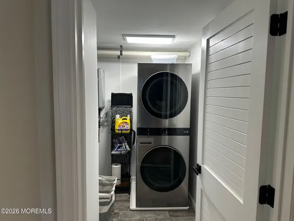 a view of a hallway with washer and dryer