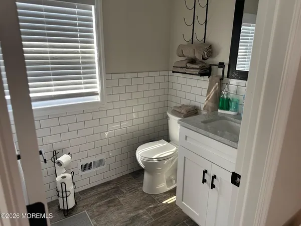 a bathroom with a toilet and a sink