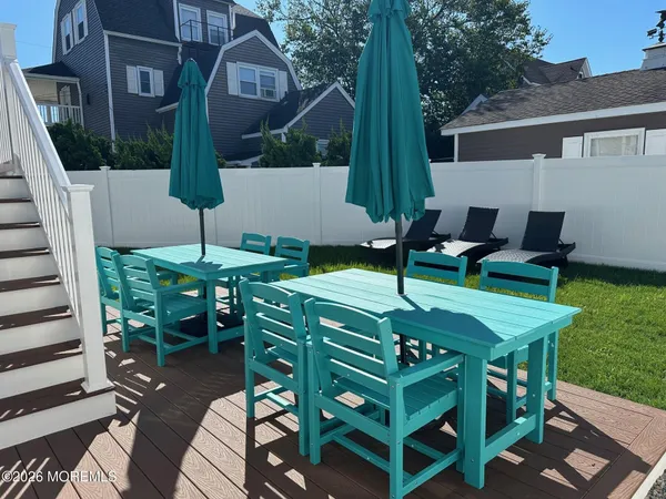 a patio with table and chairs
