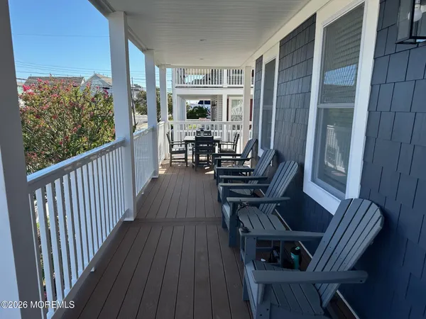 a view of a house with porch and wooden floor
