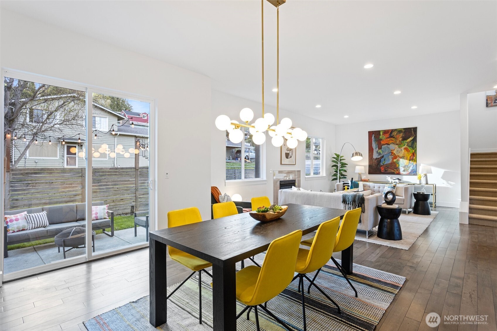 305 Stevens Avenue Southwest Renton, WA 98057 - Photo 11 of 40 a view of a dining room with furniture window and wooden floor