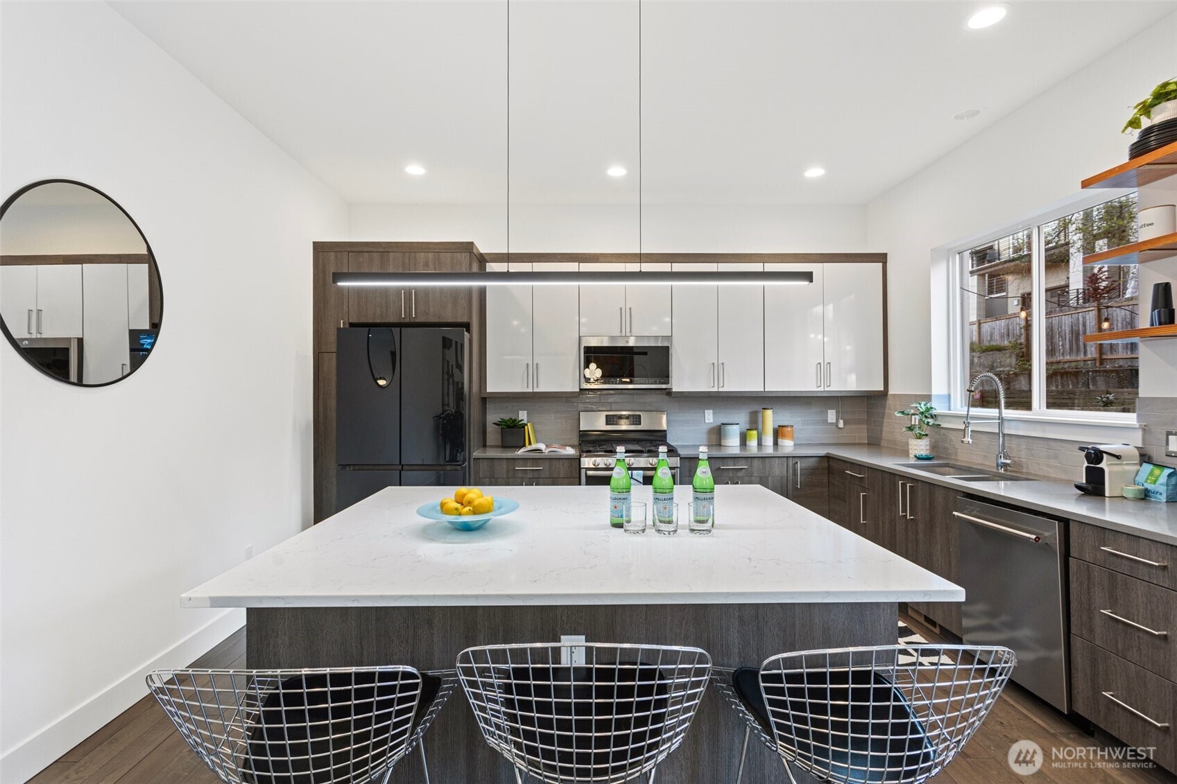 305 Stevens Avenue Southwest Renton, WA 98057 - Photo 12 of 40 a kitchen with a sink cabinets and window