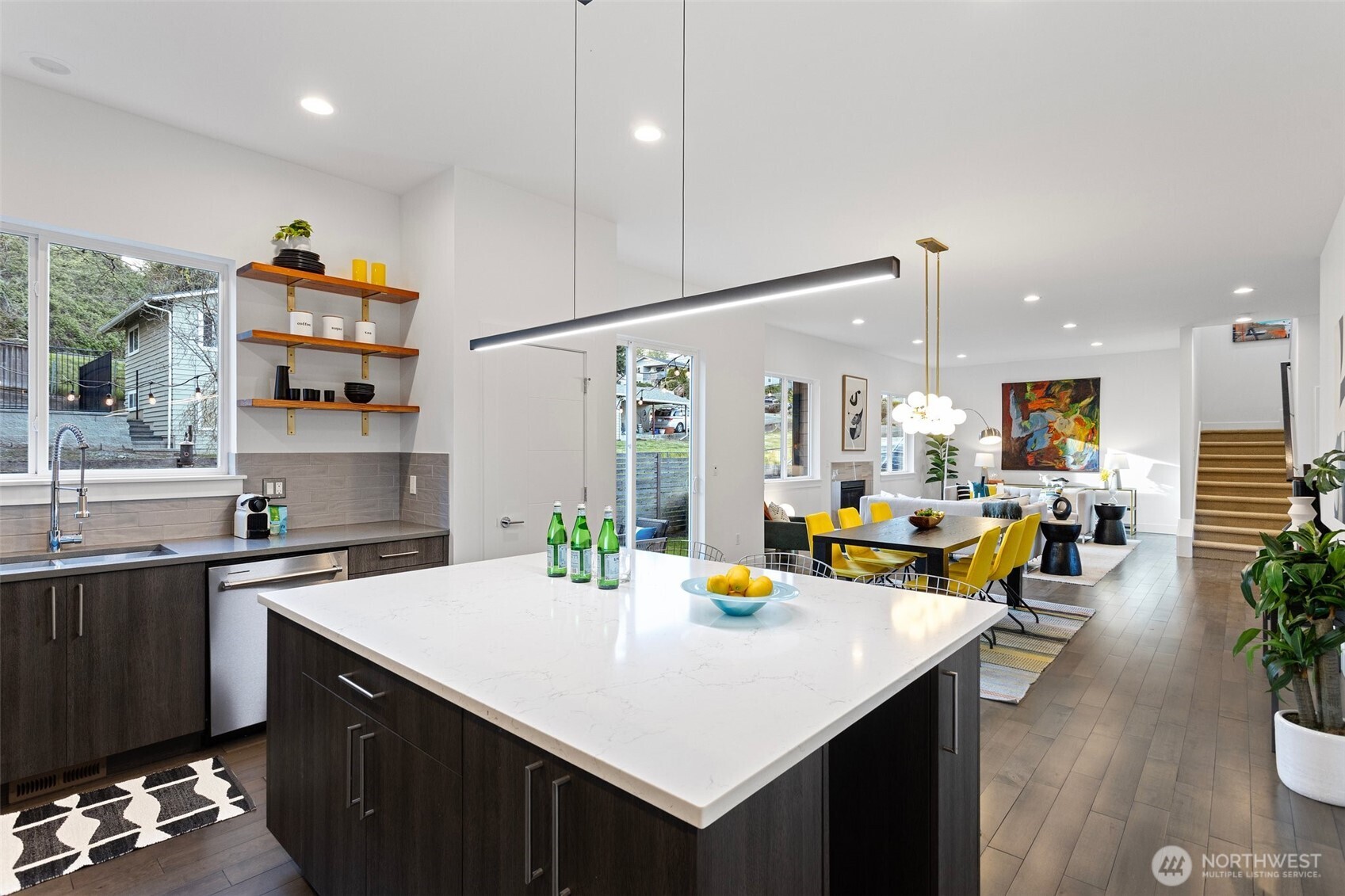 305 Stevens Avenue Southwest Renton, WA 98057 - Photo 14 of 40 a kitchen with a sink a refrigerator and wooden cabinets