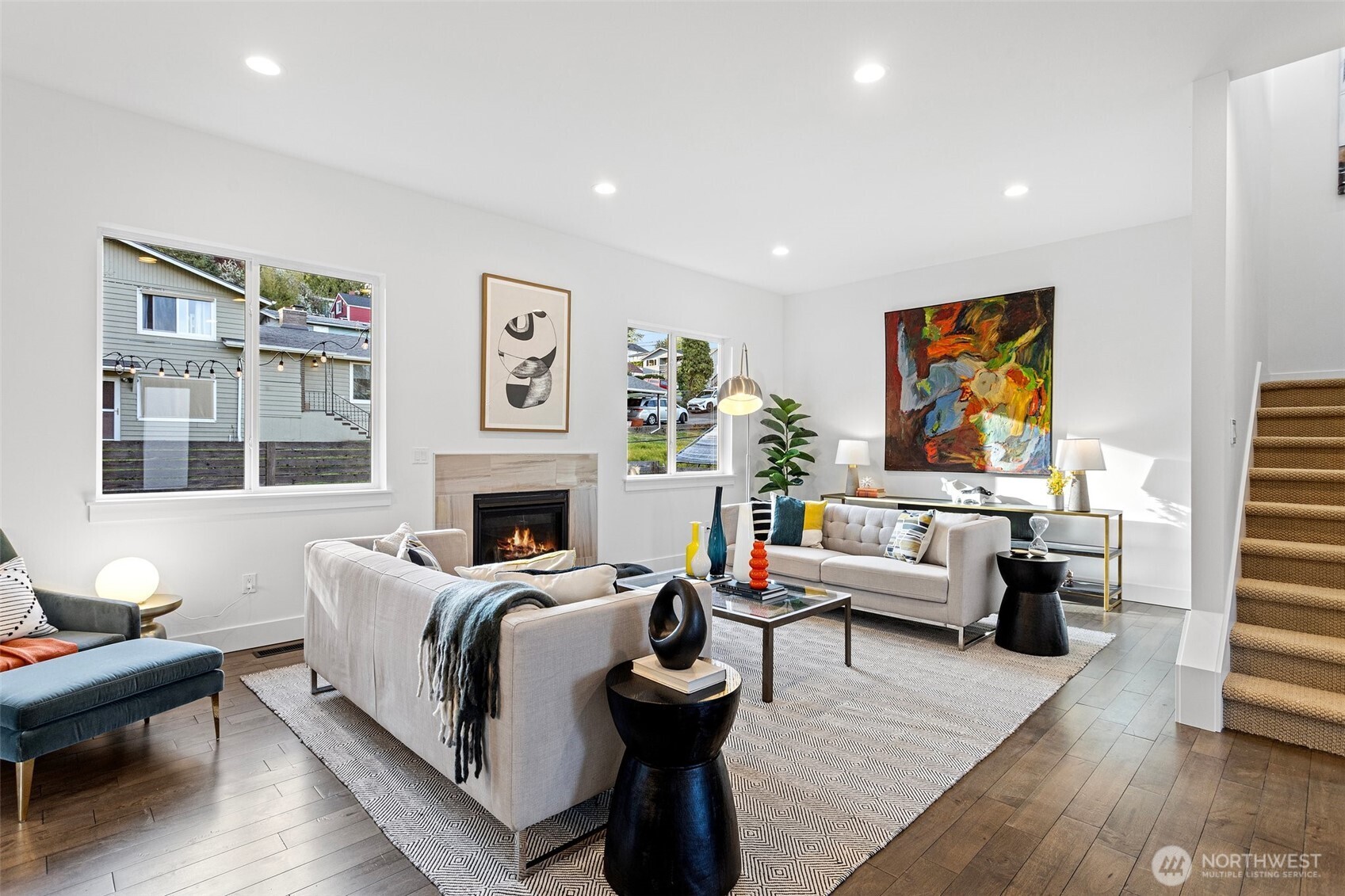 305 Stevens Avenue Southwest Renton, WA 98057 - Photo 6 of 40 a living room with furniture large window and a fireplace