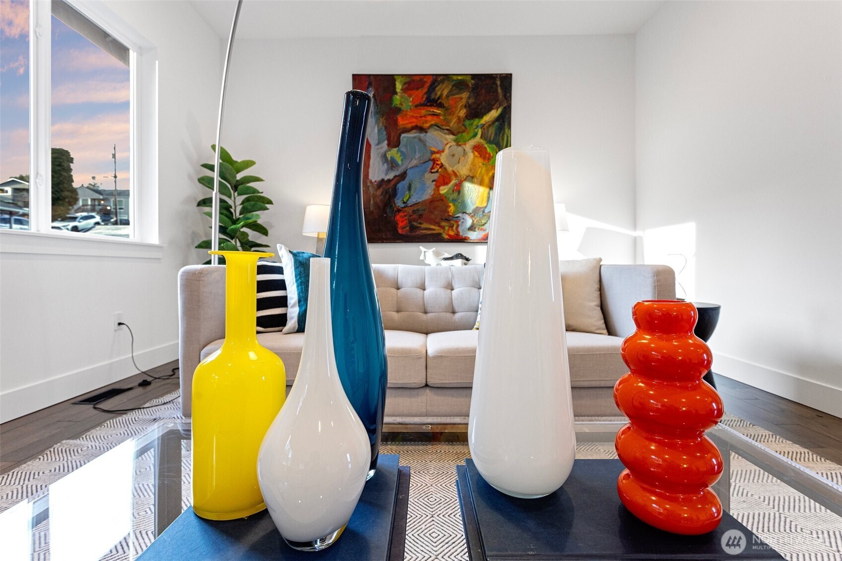 305 Stevens Avenue Southwest Renton, WA 98057 - Photo 7 of 40 a room with wooden floor and a potted plant