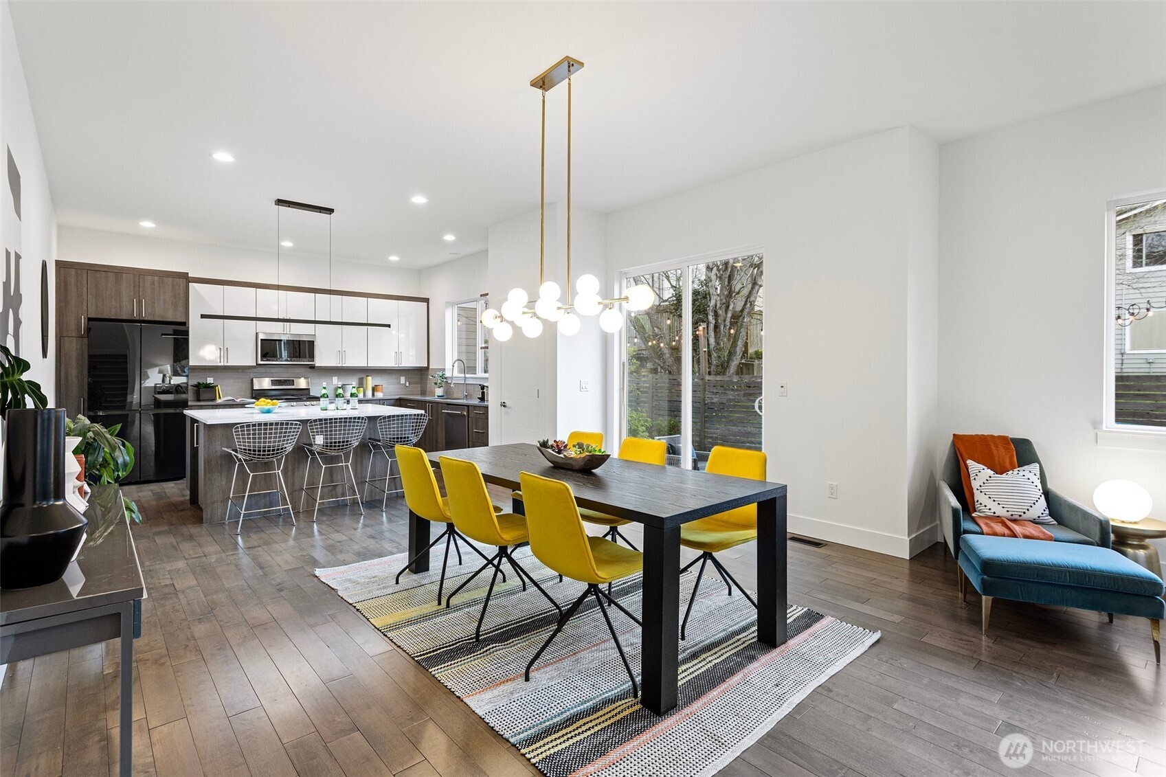 305 Stevens Avenue Southwest Renton, WA 98057 - Photo 9 of 40 a view of a dining room with furniture and window