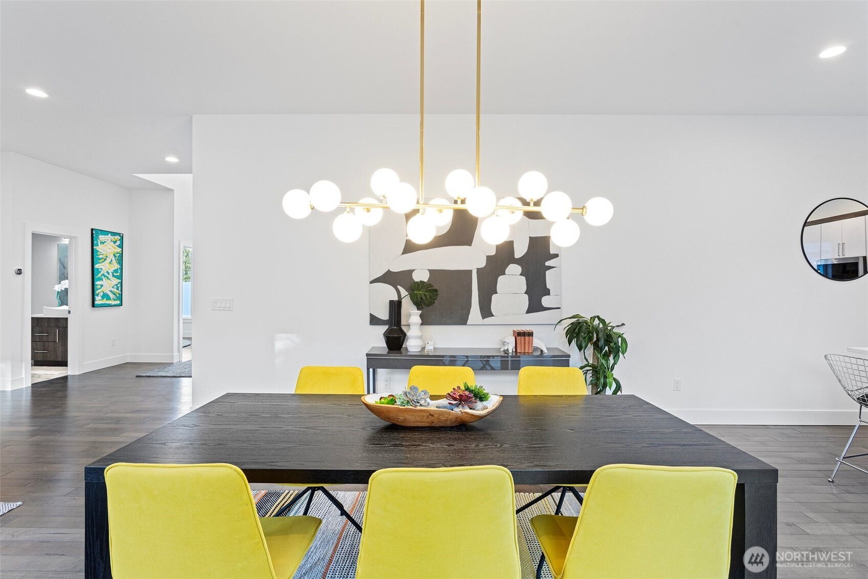 305 Stevens Avenue Southwest Renton, WA 98057 - Photo 10 of 40 a view of a dining room with furniture and a chandelier