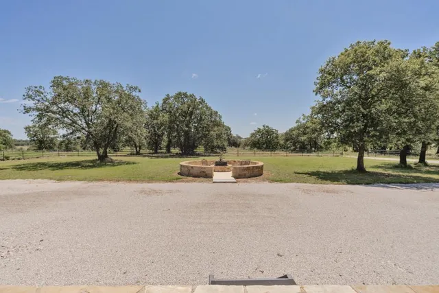 a view of a lake with a yard