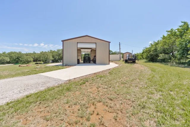 a spacious bathroom with a sink and a yard