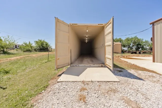 a view of a dry yard with an outdoor space