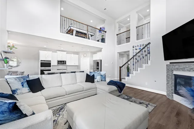 a living room with fireplace furniture and a flat screen tv