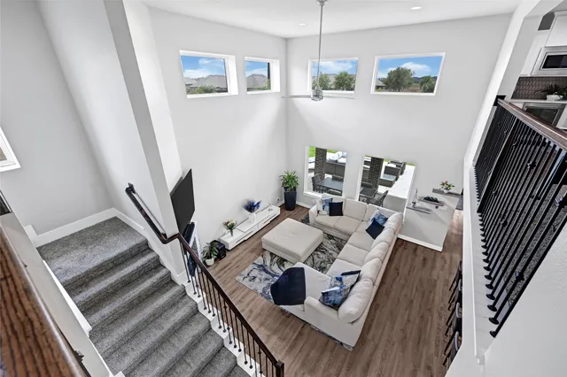 a view of living room with furniture and a flat screen tv