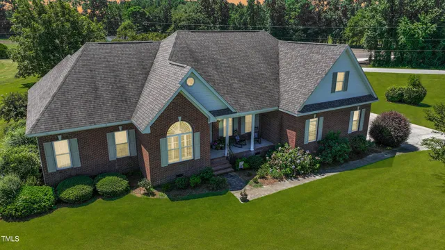 a aerial view of a house with garden and plants