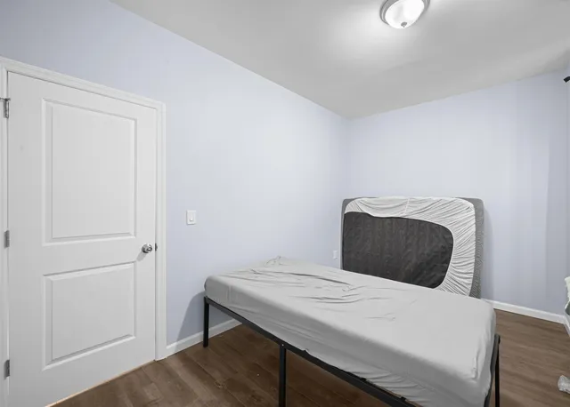 a bedroom with a bed and a cabinets