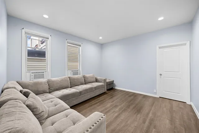 a living room with furniture and window