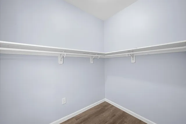 a view of a room with shelf on the wall