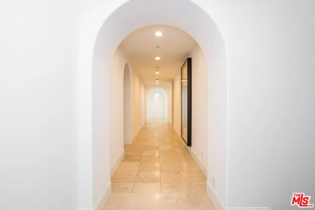 a view of a hallway with a white walls
