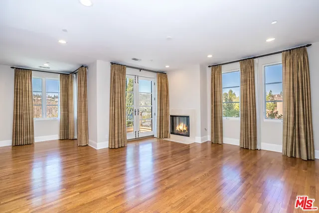 a living room with furniture or couch and a fireplace