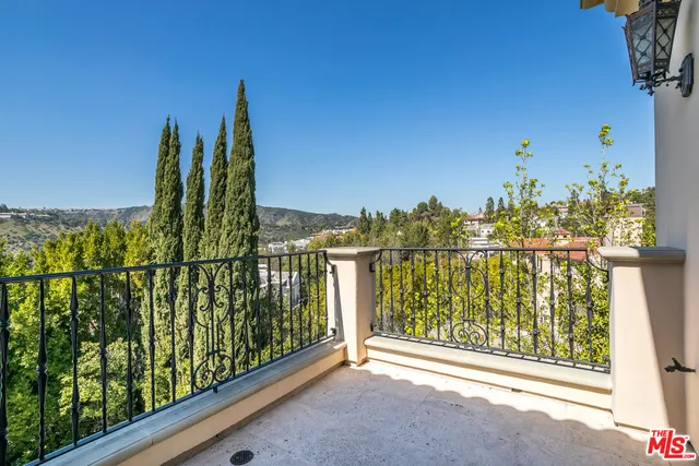 a view of a city with lush green forest