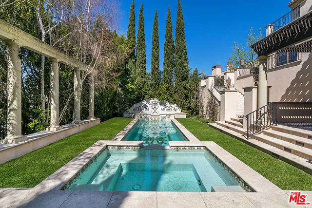 a living room with fireplace furniture and a fireplace