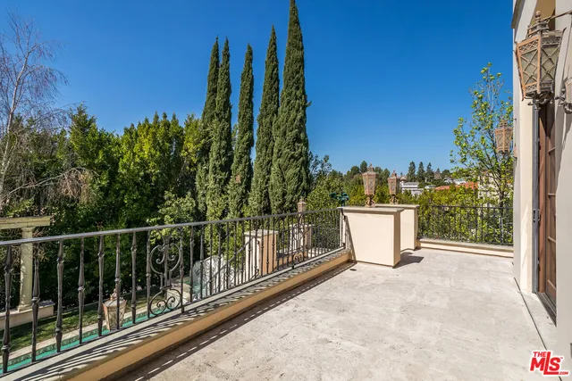 a view of a balcony with chairs