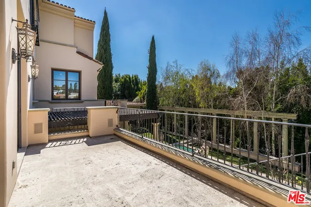 a view of balcony with two chairs and a table