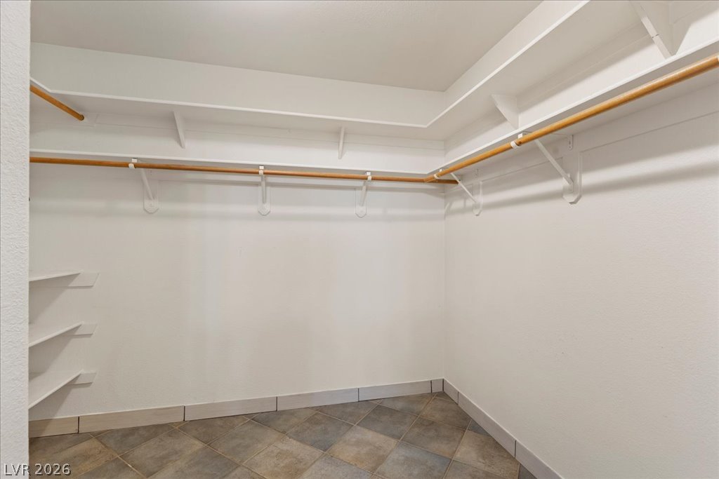 120 Ringlore Road Henderson, NV 89015 - Photo 20 of 58 Ample built-in shelving and hanging rods maximize storage space inside this walk-in closet.