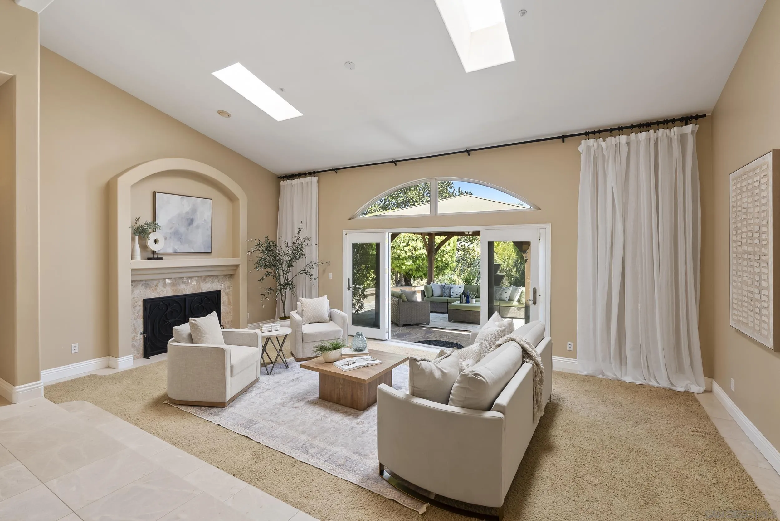 14998 Budwin Lane Poway, CA 92064 - Photo 14 of 44 a living room with furniture a fireplace and a large window